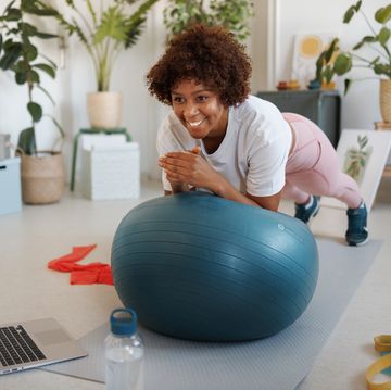 woman using exercise ball to plank at home woman using exercise ball to plank at home