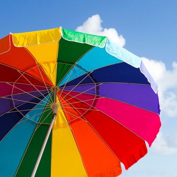 rainbow beach umbrellas against blue sky rainbow beach umbrellas against blue sky