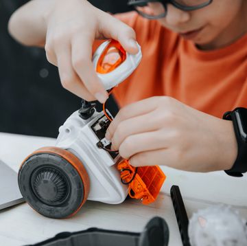 boy playing with robot toy