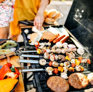vegetable skeweres hot dogs burgers buns on grill vegetable skeweres hot dogs burgers buns on grill