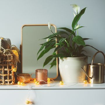 mirror blankets string lights and candles on dresser