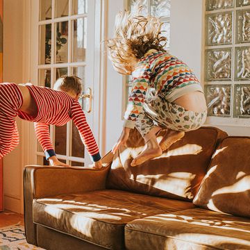 kids jumping on leather sofa kids jumping on leather sofa