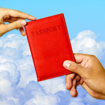 hands holding passport with cover