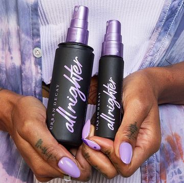 hands holding urban decay all nighter setting spray