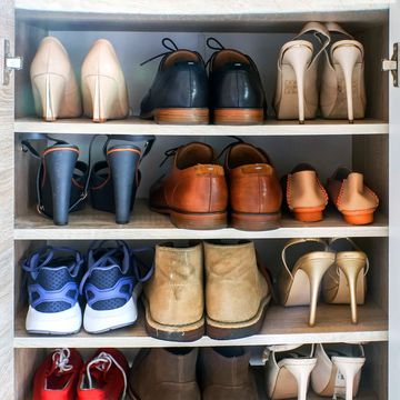 heels boots sneakers on shelves in shoe cabinet heels boots sneakers on shelves in shoe cabinet
