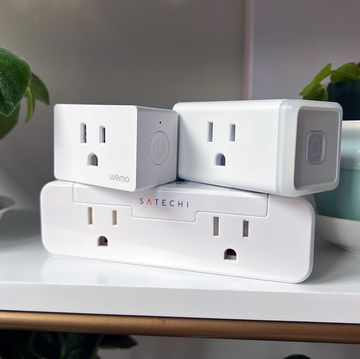 satechi kasa and wemo smart plugs on shelf with plants satechi kasa and wemo smart plugs on shelf with plants