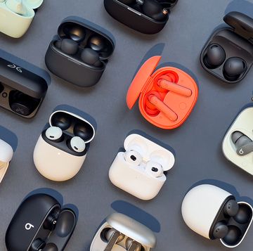 collection of wireless earbuds in charging cases collection of wireless earbuds in charging cases